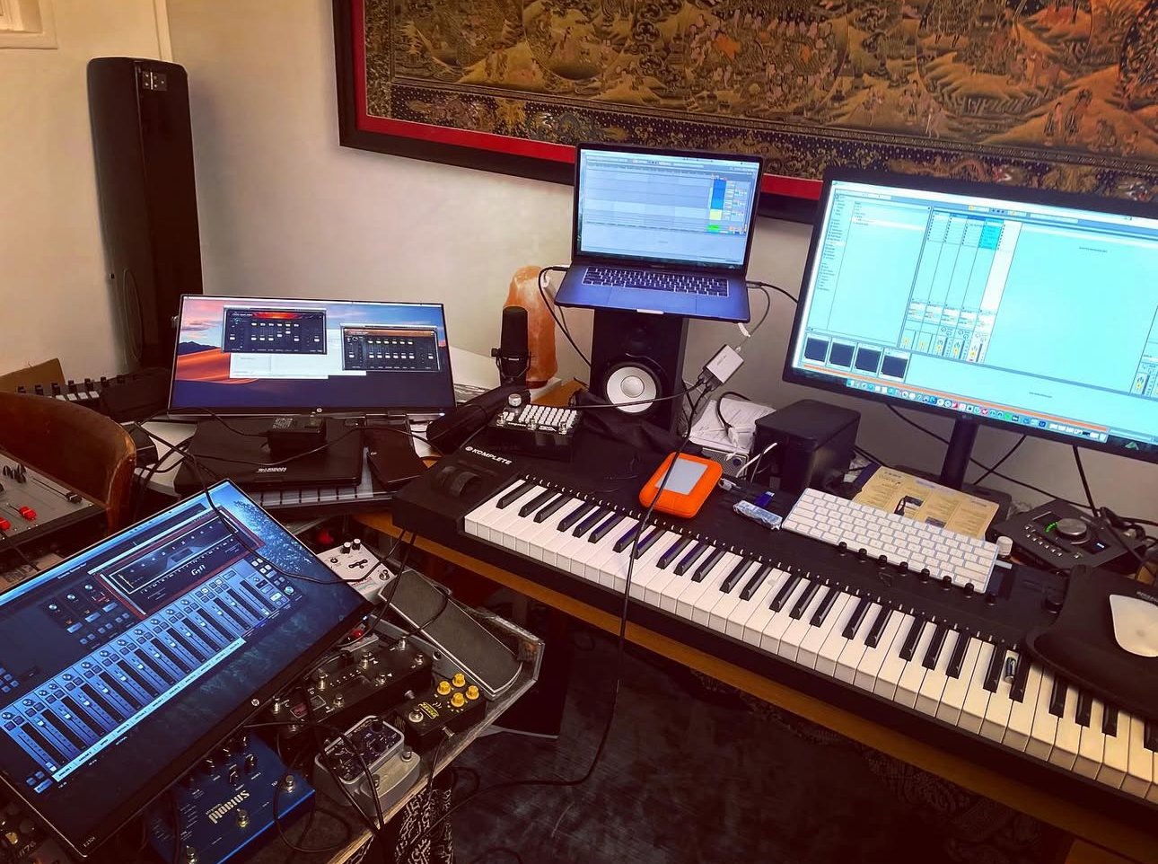 Studio setup with keyboards and monitors